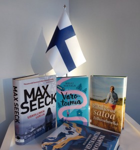 Bild på finska böcker och finsk flagga
